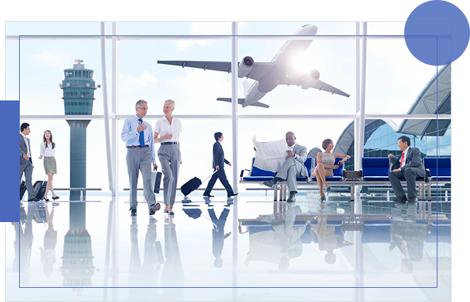 A group of people walking around an airport.